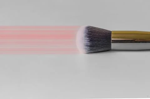 Makeup brush on a grey background Stock Photos