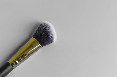 Makeup brush on a grey background Stock Photos