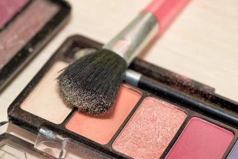 Makeup brush on makeup box, close up Stock Photos