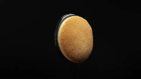 Makeup brush. Makeup brush rotates. Brush on a black background. Stock Footage 128784088