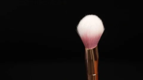 Makeup brush. Makeup brush rotates. Brush on a black background. Stock Footage 128784098