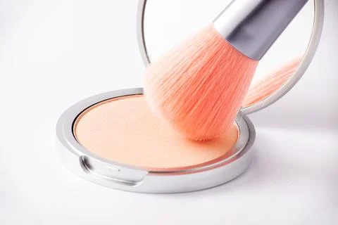 Makeup brush picks eyeshadow in macro. Makeup product Stock Photos