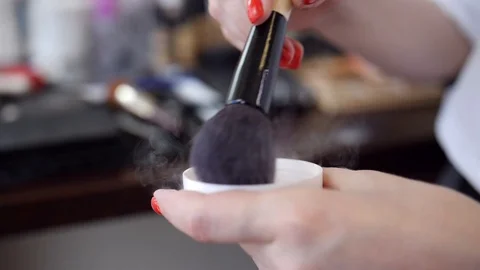 Makeup brush with powder moving,  visagiste use brush with cosmetics slow motion Stock Footage 96230170