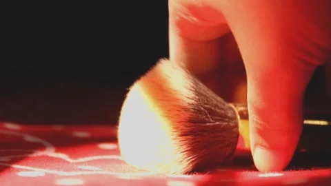 Makeup brush with powder in slow motion on black background Stock Footage 148611012