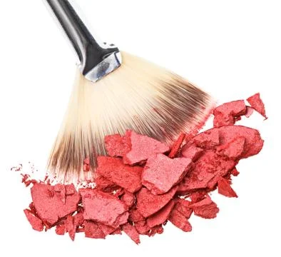Makeup brush with red crushed eye shadow, isolated on white macro Foto stock