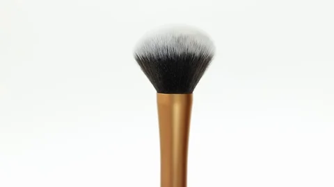 Makeup brush rotates on a white background. Makeup brush. Close-up. Stock Footage 128191170