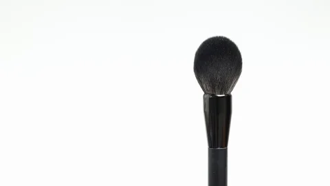 Makeup brush rotates on a white background. Makeup brush. Close-up. Stock Footage 128191186