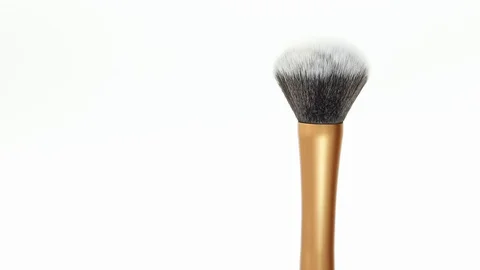 Makeup brush rotates on a white background. Makeup brush. Close-up. Stock Footage 128191224