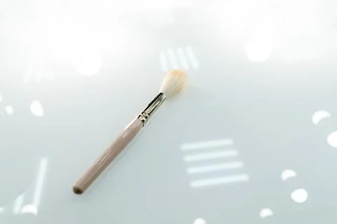 Makeup brush on the table close-up. Stock Photos