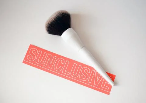 Makeup brush with text sunclusive Stock Photos