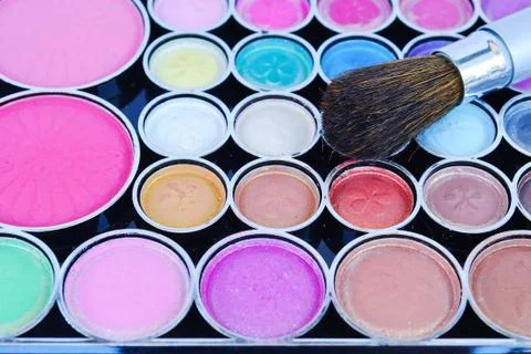 Makeup brushes and make-up eye shadows Stock Photos