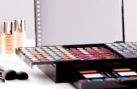 Makeup brushes and make-up eye shadows Stock Photos