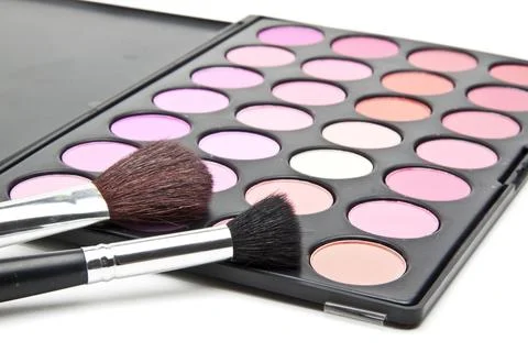 Makeup brushes and make-up eye shadows Stock Photos