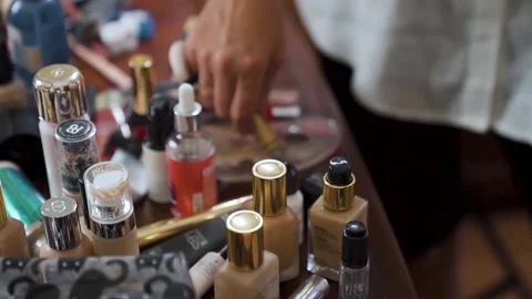 Makeup brushes and other make up utensils on the counter - camera slide Stock Footage 214017215