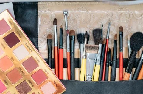 Makeup brushes are in a drawer at the makeup artist's workplace. close-up Stock Photos