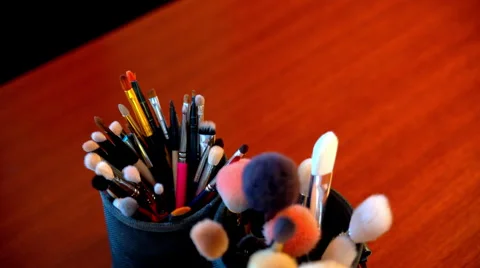 Makeup brushes are on the table Stock Footage 65212551