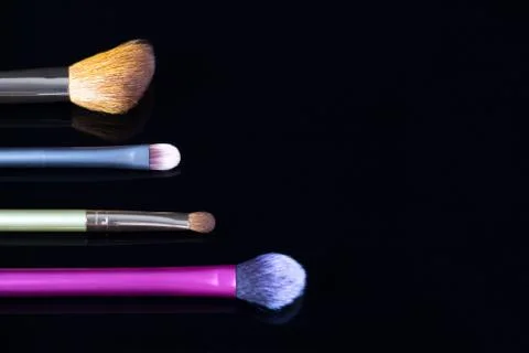 Makeup brushes on black background. Cosmetics, fashion, beauty, glamour. Acce 스톡 사진