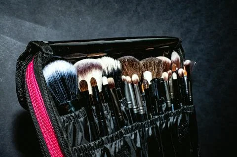 Makeup brushes on a black background, with a place to insert text, 写真素材