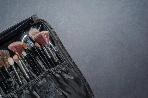 Makeup brushes on a black background, with a place to insert text, Stock-Fotos