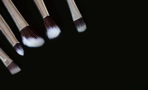 Makeup brushes on black background.Copy space Stock Photos