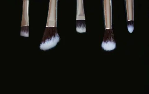 Makeup brushes on black background.Copy space Stock Photos