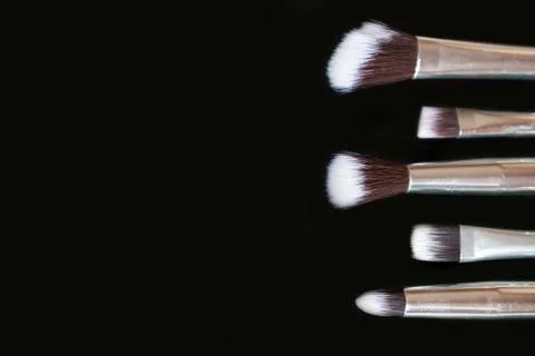 Makeup brushes on black background.Copy space Stock Photos