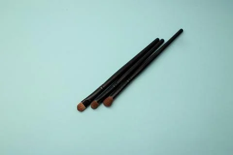 Makeup brushes on a blue background Stock Photos