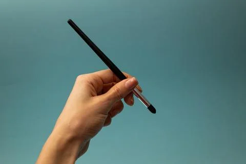 Makeup brushes on a blue background Stock Photos