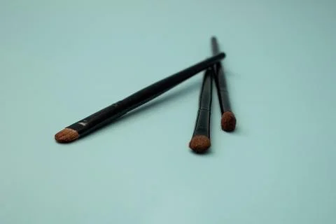 Makeup brushes on a blue background Stock Photos