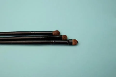 Makeup brushes on a blue background Stock Photos