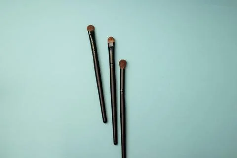 Makeup brushes on a blue background Stock Photos