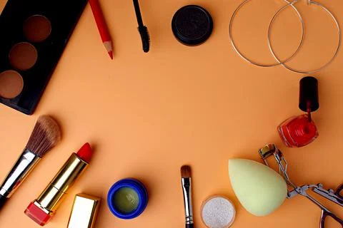 Makeup brushes for blush and eyeshadow, sponge, pink lipstick, lip gloss Stock Photos