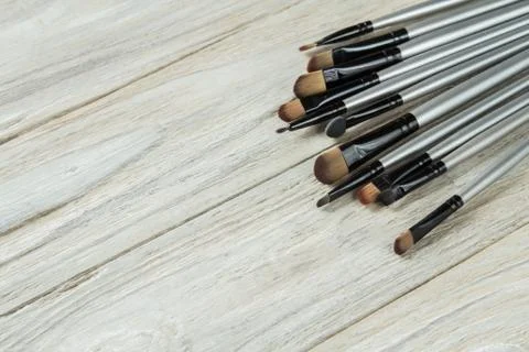 Makeup brushes in the corner on background Stock Photos