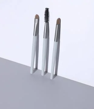 Makeup brushes with different applicators on white background Stock Photos