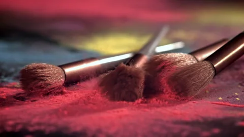 Makeup brushes fall on the table. Filmed on a high-speed camera at 1000 fps. Stock Footage 308465151