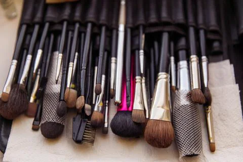 Makeup brushes lie on the table Stock Photos