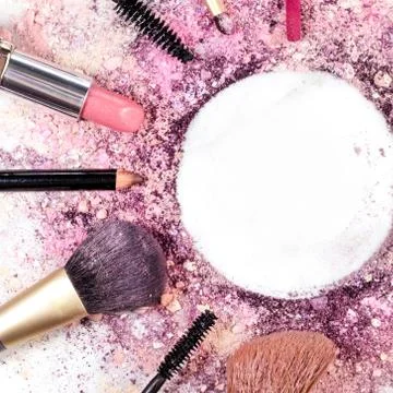 Makeup brushes, lipstick etc forming frame for copyspace Foto stock