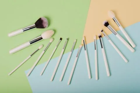 Makeup brushes on a multicolored background close up Foto stock