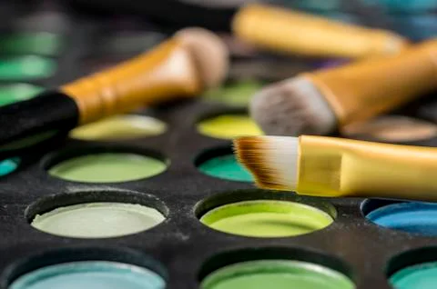 Makeup brushes on palette Stock Photos