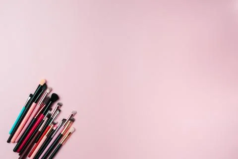 Makeup brushes on pink background. Copy space Stock Photos