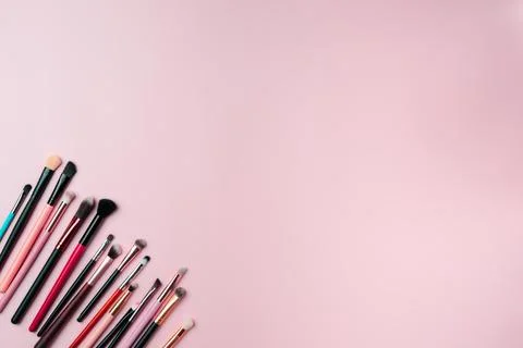 Makeup brushes on pink background. Copy space Stock Photos