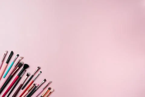 Makeup brushes on pink background. Copy space Stock Photos