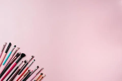 Makeup brushes on pink background. Copy space Stock Photos