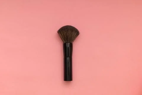Makeup brushes on a pink background. Stock Photos