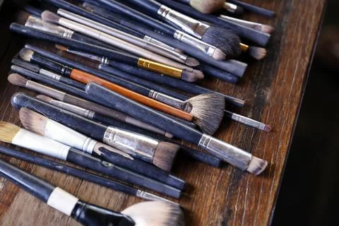 Makeup brushes in a row on a surface Stock Photos