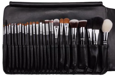 Makeup brushes set in leather case. Isolated. White background Stock Photos