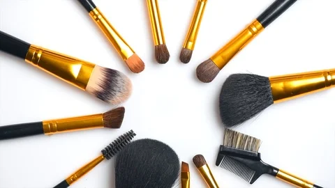 Makeup brushes set rotated over white background. Professional makeup brushes Stock-Footage 101379332
