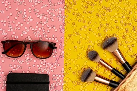 Makeup brushes, sunglasses and notebook, top view Stock Photos