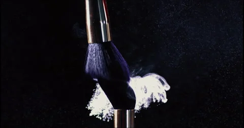 Makeup brushes touch each other on dark background Stock Footage 245273335