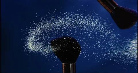 Makeup brushes touch each other on dark background Stock Footage 245274203